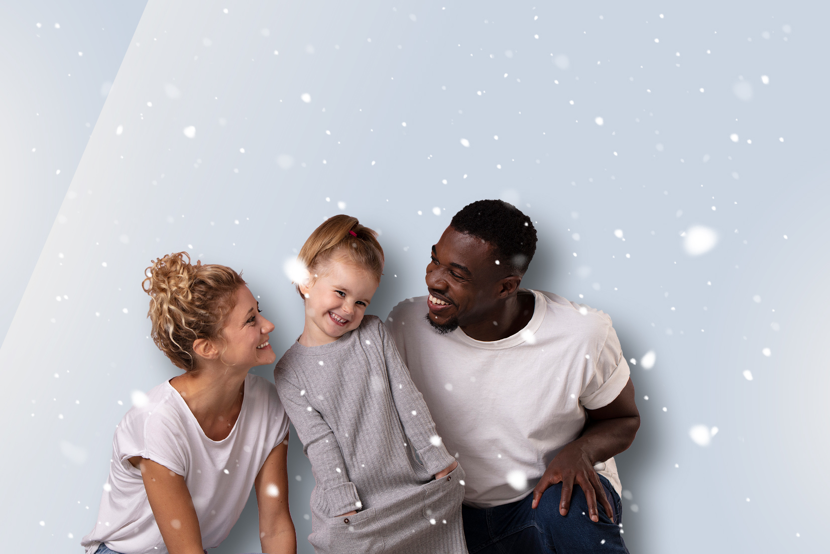 Familie mit Schneefall